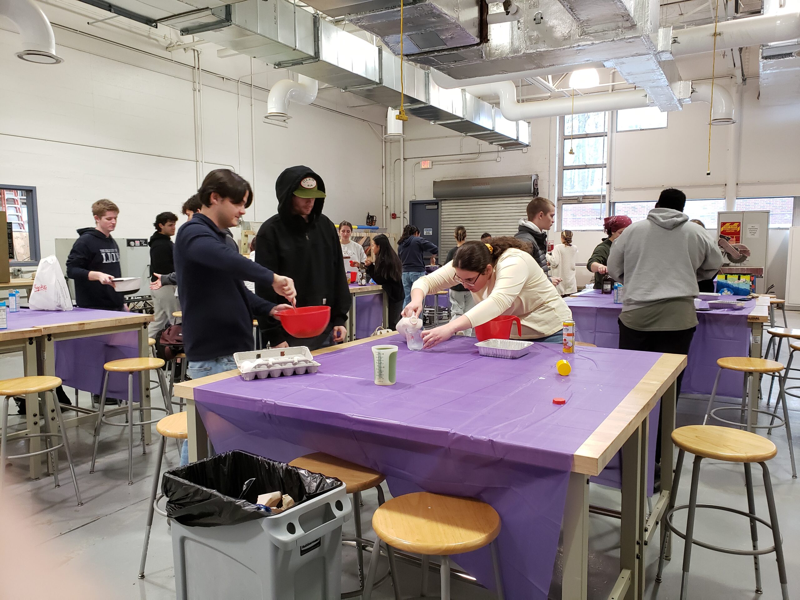 Students are measuring milk and other ingredients for the cornbreads.