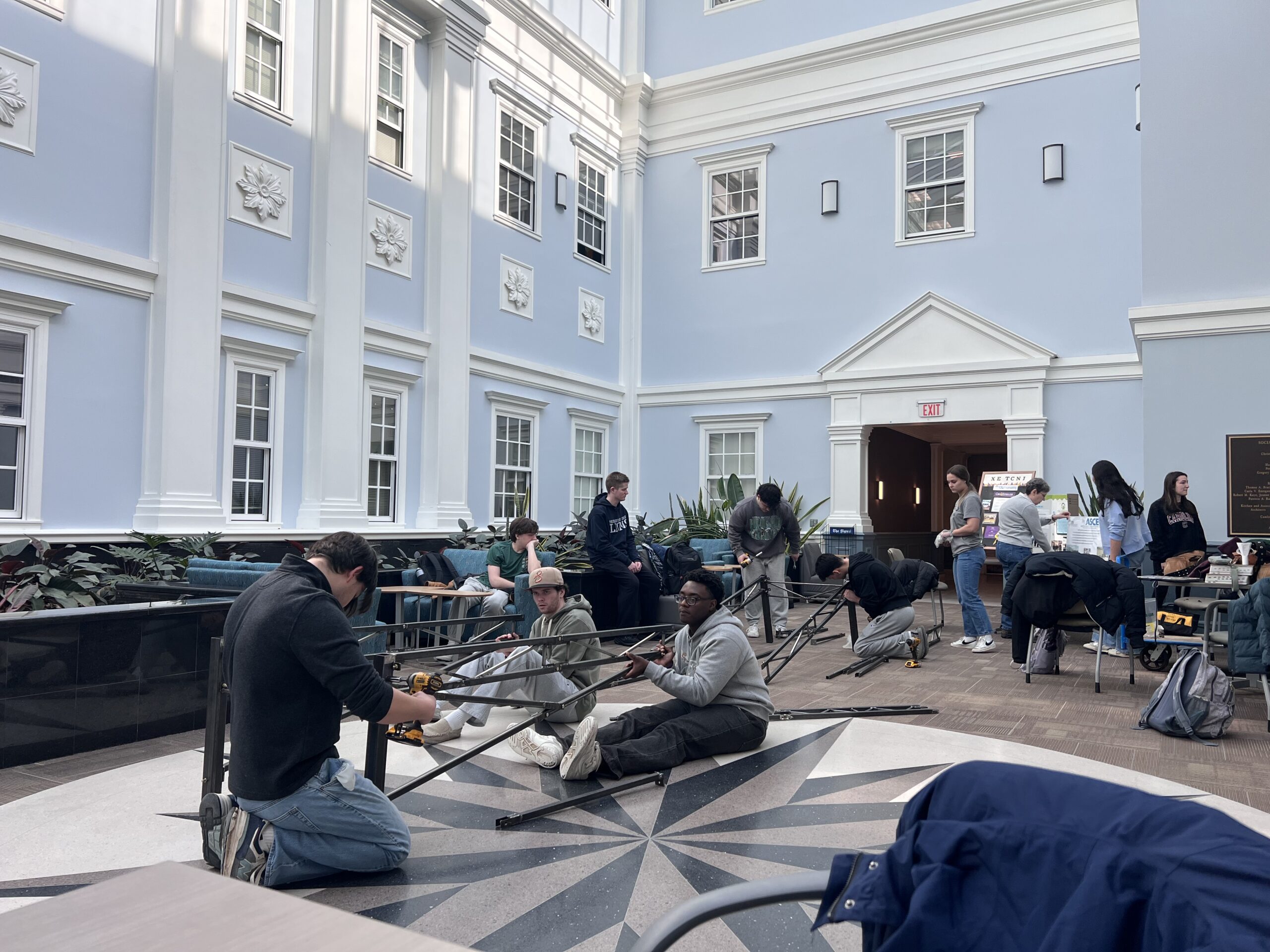 Students constructing the bridge.